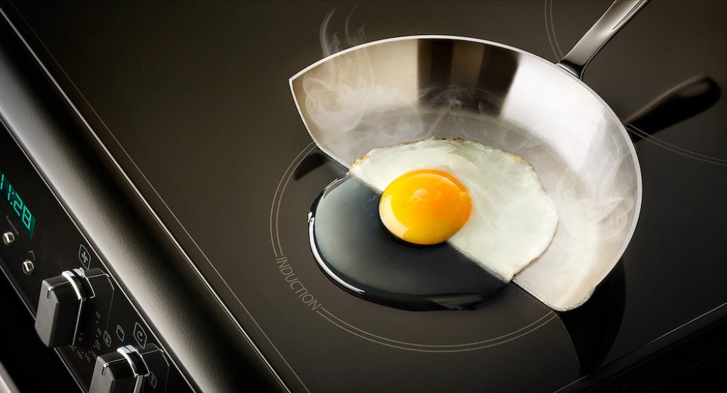 Image commissioned by Peter Lawson at Which Magazine illustrating that oscillating magnetic field of the induction cooker heats up only the metal cookware and not top surface the hob. The heat is only generated by the metal of the pan as the surface of the cooker stays cold.